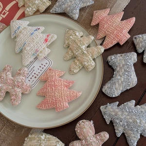 Elegant tweed Christmas ornaments set in soft pink and ivory with gold thread accents