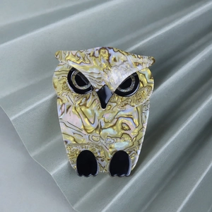 Artistic acrylic owl brooch with yellow abalone shell texture and golden finish