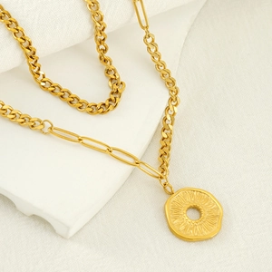 Vintage 18k gold plated double layer necklace with textured coin pendant on silk fabric