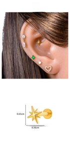 Macro view of gold titanium star labret stud showing dimensions and ear styling