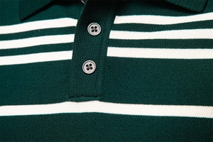 Detail of knit polo collar and button placket on green and white striped sweater