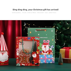 Detailed view of Christmas gift boxes with transparent windows and festive patterns