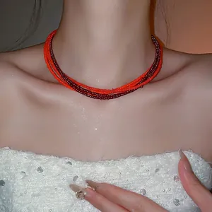 Elegant multi-layer red seed bead necklace for women featuring a minimalist layered design