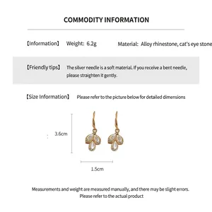 Detailed size and material chart for teardrop cat's eye earrings with cubic zirconia