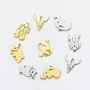 Macro shot of assorted stainless steel animal charms in gold and silver finish