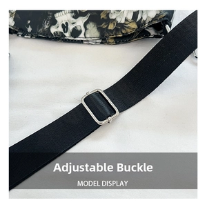 Detail view of the adjustable metal buckle on a gothic skull printed tote bag strap