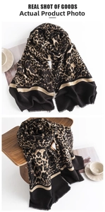 Detail of leopard print cashmere scarf with elegant fringe edges and color block design