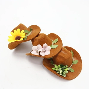 Mini brown felt cowboy hats with sunflower and berry floral decor for party bottle toppers