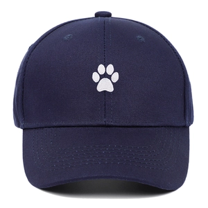 Classic navy blue cotton baseball cap with white cartoon paw embroidery for men and women