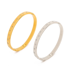 Polished titanium steel North Star bracelets in gold and silver with zircon accents