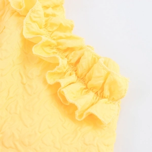 Yellow textured long dress with ruffled edges and embossed bubble floral patterns