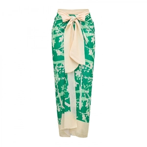 Floral print wrap skirt in vibrant green with an elegant cream ribbon bow accent