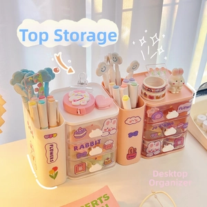 Close-up of pink desk organizer with cute rabbit patterns and three storage drawers