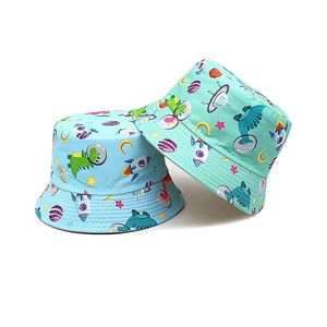 Kids dinosaur space bucket hats in blue and green with astronaut prints for sun protection