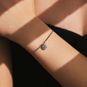 Elegant s925 silver flat snake chain bracelet with a sparkling single round zircon pendant