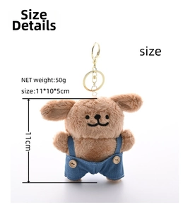 Detail of plush dog keychain in blue denim overalls with size and weight metrics