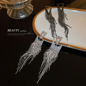 Silver and black geometric triangle earrings with shimmering long fringe tassels