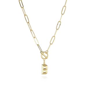 Detailed view of golden paperclip chain necklace with B initial pendant and toggle clasp