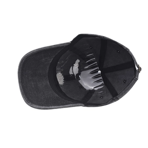 Detail view of washed cotton baseball cap interior with sweatband and metal adjustment buckle