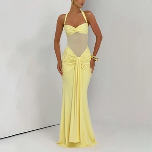 Detail of yellow ruched maxi dress featuring sexy backless design and sheer mesh waist insert