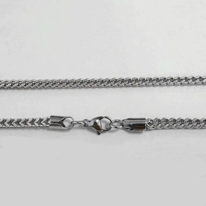 Detail showing high-quality stainless steel Franco chain weaving with a sturdy lobster clasp
