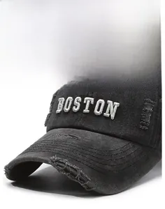 Close-up of vintage distressed black denim baseball cap with BOSTON embroidery detail