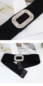 Detail of black elastic wide waist belt featuring a rectangular rhinestone metal buckle