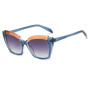 Fashion cat-eye sunglasses with blue-orange gradient frames and purple tinted lenses
