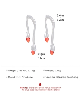 Detail view of silver liquid metal earrings with red teardrop stones and measurements