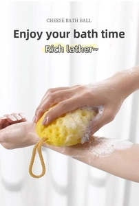 Detail showing the rich lather production of a yellow honeycomb cheese bath sponge