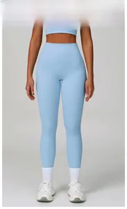 Detail showing the seamless sky blue high waist yoga pants and fabric texture on a model