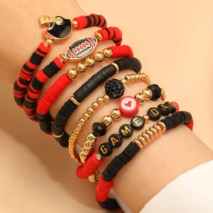Detail of multi-layer Game Day bracelet set with football charms and acrylic letter beads