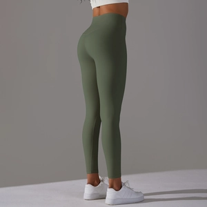 Close-up of olive green high-waisted yoga pants showcasing elastic fabric and stitching