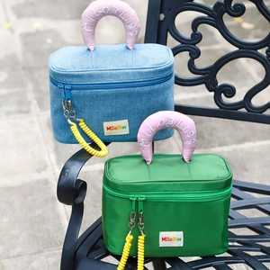 Colorblock large capacity cosmetic bags with unique telephone cord pulls on chair