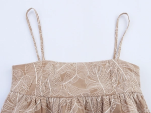 Detailed close-up of khaki embroidery lace on women camisole neckline and thin straps