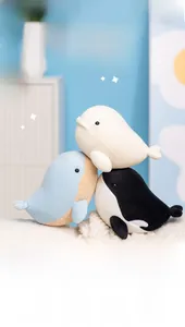 Detailed close-up of soft ocean whale plush toys featuring various colors and textures
