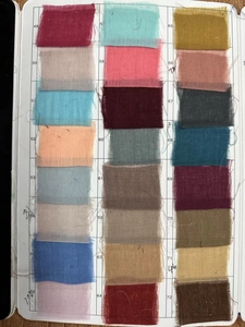 Sample book showing various colored gauze fabric swatches with numeric identification