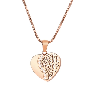 Collier pendentif cœur en or rose avec motifs de volutes évidés et zircons clairs