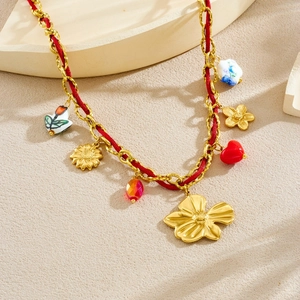 Floral gold-plated necklace with red rope chain and white ceramic sunflower heart pendants