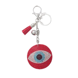 Sparkling red Evil Eye keychain with tassel and rhinestones on white background