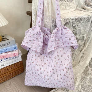 Detail of lavender floral tote bag with ruffle trim and seersucker textured fabric