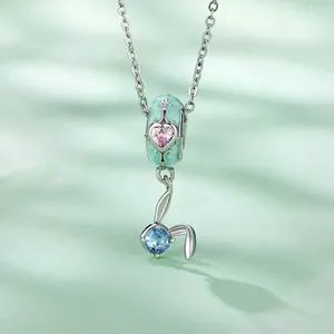 S925 sterling silver Easter egg charm with heart gemstone and blue drop pendant