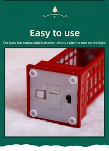 Detailed base view of Christmas lantern featuring battery compartment and power switch