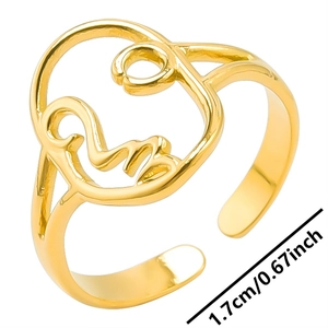 Detail view of gold abstract face ring showing 1.7cm adjustable inner diameter size