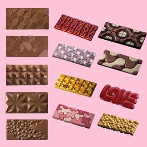 Detailed view of assorted 3D mousse cake molds in various shapes and colors