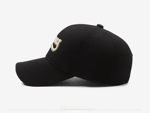 Detail view of the high-quality 3D embroidery on the side of this black baseball cap