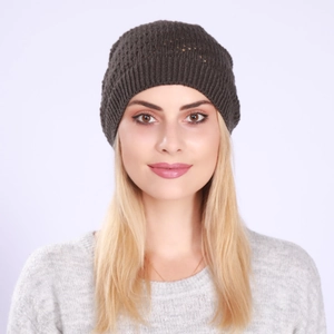Close-up of a model wearing a dark grey knitted beanie hat with a fine ribbed texture