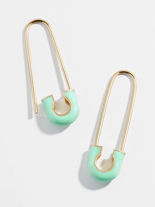 Creative gold-tone safety pin earrings with mint green glaze in a modern drop design