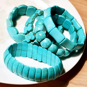 Elastic turquoise beaded bracelet set with vintage heart heart charms in rustic style