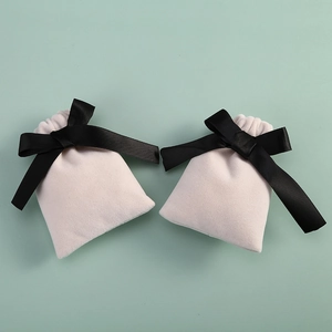 Elegant velvet drawstring pouches for jewelry packaging with black satin ribbon bows